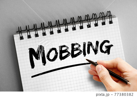 Mobbing text on notepad, concept background Mobbing text on notepad, concept background 77380382
