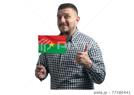 White guy holding a flag of Burkina Faso and shows the class by hand isolated on a white background. Like for Burkina Faso White guy holding a flag of Burkina Faso and shows the class by hand isolated on a white background. Like for Burkina Faso 77380441