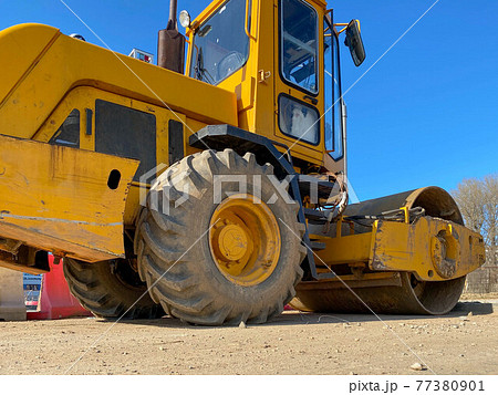 Construction site is laying new asphalt road pavement,road construction workers and road construction machinery scene.highway construction site landscape 77380901
