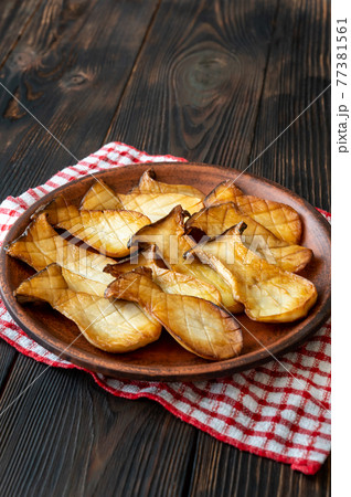 King oyster mushrooms on the serving plate King oyster mushrooms on the serving plate 77381561