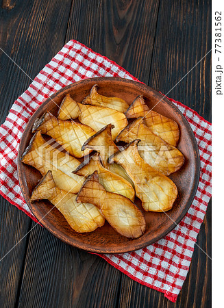 King oyster mushrooms on the serving plate 77381562