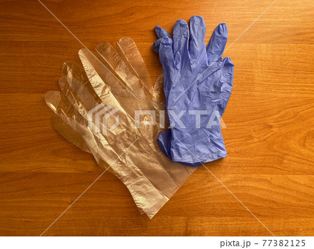 Blue latex gloves. Gloves for the food industry. Disposable plastic gloves is universal protection Blue latex gloves. Gloves for the food industry. Disposable plastic gloves is universal protection 77382125