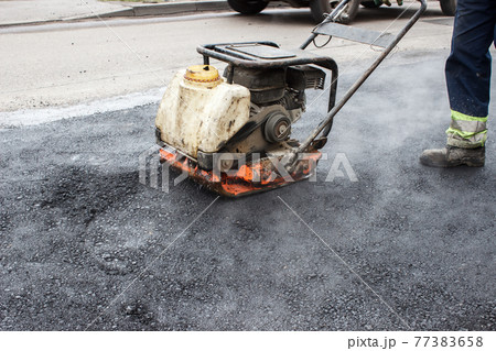 asphalt rammer. laying the road surface 77383658