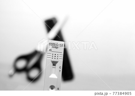 Testing Before Visiting The Hairdresser: Rapid Antigen Corona Test Showing A Negative Result In Front of Scissors and Comb Testing Before Visiting The Hairdresser: Rapid Antigen Corona Test Showing A Negative Result In Front of Scissors and Comb 77384905