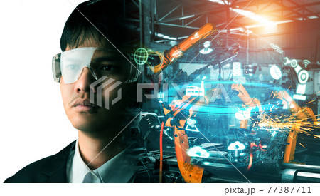 Mechanized industry robot arm and factory worker double exposure 77387711