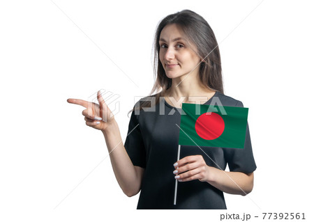 Happy young white woman holding flag Bangladesh and points to the left isolated on a white background Happy young white woman holding flag Bangladesh and points to the left isolated on a white background 77392561