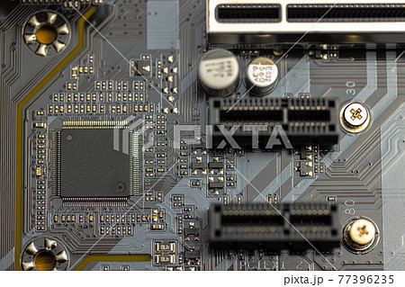 Closeup of computer board with conductors 77396235