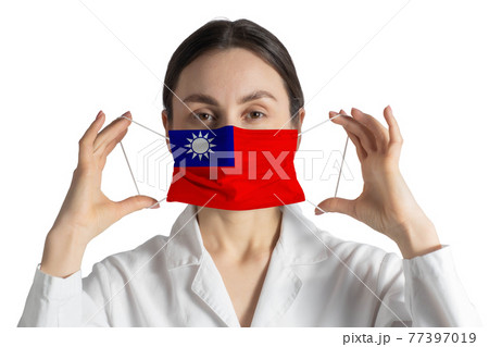 Respirator with flag of Republic of China Doctor puts on medical face mask isolated on white background Respirator with flag of Republic of China Doctor puts on medical face mask isolated on white background 77397019