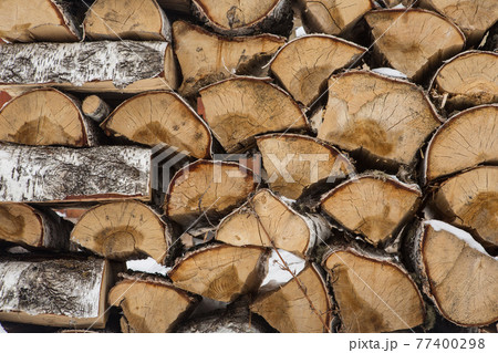 A pile of birch wood. prepared for the winter for kindling the village stove 77400298