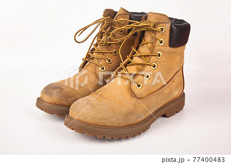 Hiking shoes and a white background, Sturdy hiking boots 77400483