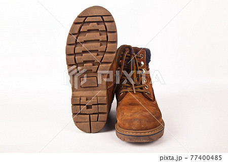 Hiking shoes and a white background, Sturdy hiking boots 77400485
