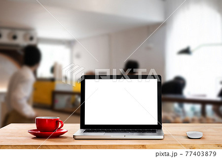 Workplace with notebook laptop and coffee cup Comfortable work table in cafe. Workplace with notebook laptop and coffee cup Comfortable work table in cafe. 77403879