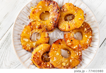 Roasted pineapple with pistachios Roasted pineapple with pistachios 77403980