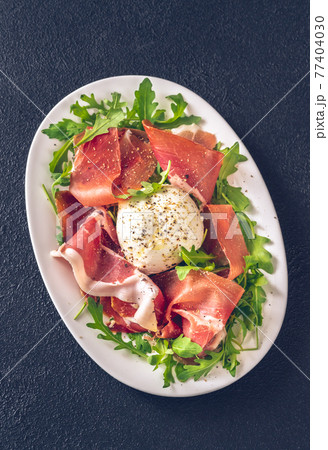 Antipasto with prosciutto and mozzarella Antipasto with prosciutto and mozzarella 77404030