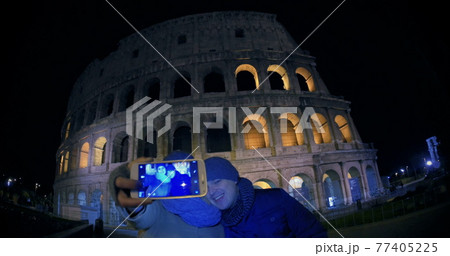 Young couple making selfie near Coliseum 77405225