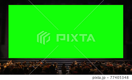 People in the auditorium with chroma key screen People in the auditorium with chroma key screen 77405348
