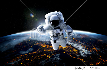 Astronaut spaceman do spacewalk while working for space station 77406260