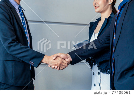 Business people handshake agreement in office. Business people handshake agreement in office. 77409061
