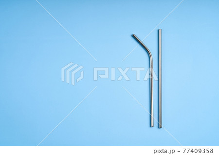 The modern trend towards caring for the environment. Two reusable metal beverage straws The modern trend towards caring for the environment. Two reusable metal beverage straws 77409358