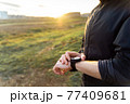 Man hands with fitness watch close up 77409681