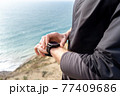 Hands with smart fitness watch close up 77409686