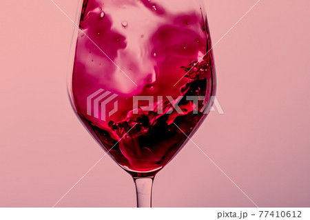 Red wine in crystal glass, alcohol drink and luxury aperitif, oenology and viticulture product Red wine in crystal glass, alcohol drink and luxury aperitif, oenology and viticulture product 77410612