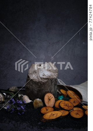 homemade wooden runes on a dark background homemade wooden runes on a dark background 77424784