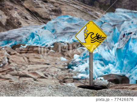 Glacier hazards danger sign Nigardsbreen Jostedal Norway 77426876