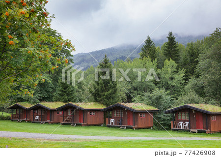 Turf roof wooden camping cabins in Norway Scandinavia Turf roof wooden camping cabins in Norway Scandinavia 77426908