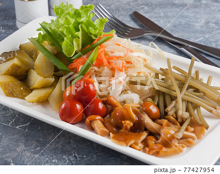 tasty assorted pickles: cucumbers, tomatoes, cabbage, mushrooms 77427954