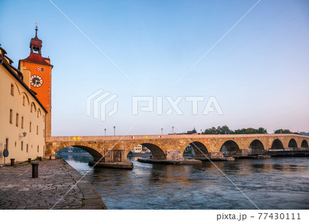 Stone Bridge over Danube river at Regensburg Bavaria Germany 77430111