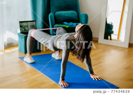 Fitness workout exercises online woman at home. Online fitness course 77434639