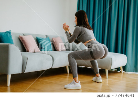 female butt workout squats at home. Fitness at home concept 77434641
