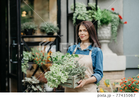 Positive emotions, successful small business and owner of floral shop outdoor 77435067