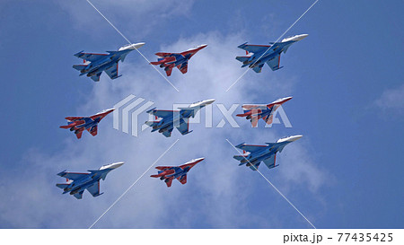 MOSCOW, RUSSIA - MAY 7, 2021: Avia parade in Moscow. group jet fighter aircraft MiG-35 and Su-30 in the sky on parade of Victory in World War II in Moscow, Russia 77435425