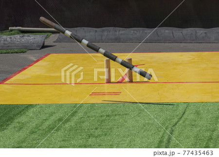 Russian national game Gorodki in which you need to knock out all the figures from the square with a wooden stick 77435463