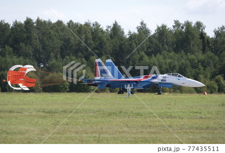 Moscow Russia Zhukovsky Airfield 31 August 2019: The Russian Knights Russkie Vityazi aerobatic team performs a demonstration flight with aerobatics figures of the international aerospace salon 77435511