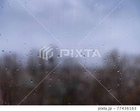 raindrops on window glass, autumn season 77436163
