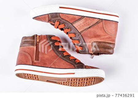 New brown sneakers, white background. 77436291