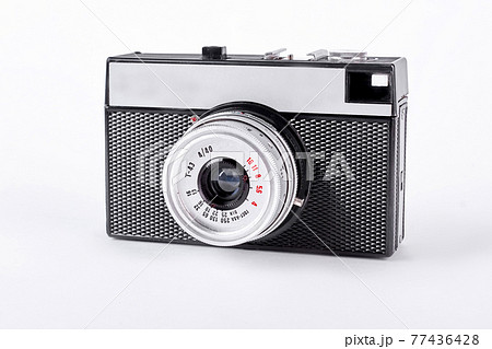 Black and silver retro camera. 77436428
