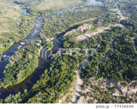 Winding bed of the Southern Bug river. River, landscape from a bird's eye view. Rough, rocky terrain. 77436699