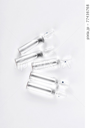 Transparent medical ampoules with liquid. Transparent medical ampoules with liquid. 77436768