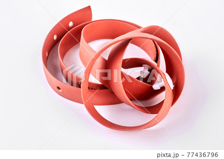 Red medical tourniquet, white background. Red medical tourniquet, white background. 77436796