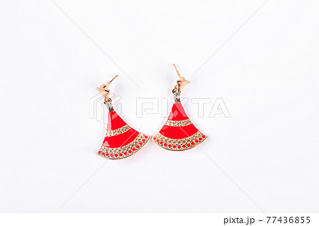 Fashion earrings on white background. Fashion earrings on white background. 77436855