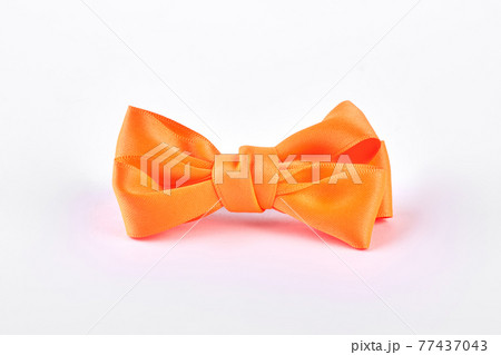 Yellow bow tie on white background. Yellow bow tie on white background. 77437043