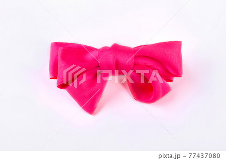 Pink bow tie on white background. Pink bow tie on white background. 77437080