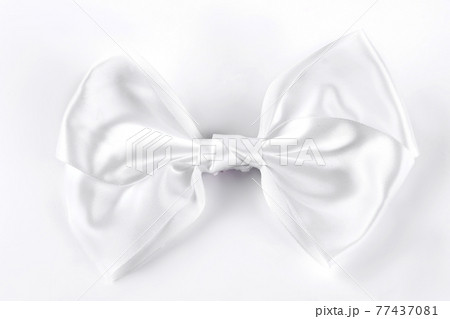 White bow tie on white background. 77437081