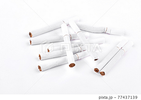 Many cigarettes on white background. Many cigarettes on white background. 77437139