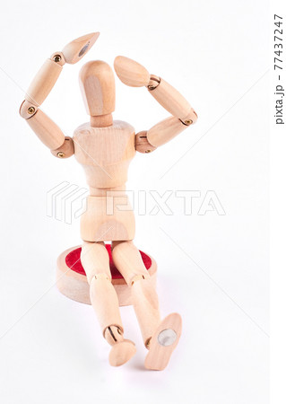 Wooden dummy raised hands above head. 77437247