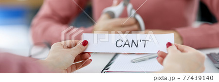 Female hands holding paper with written words can not 77439140